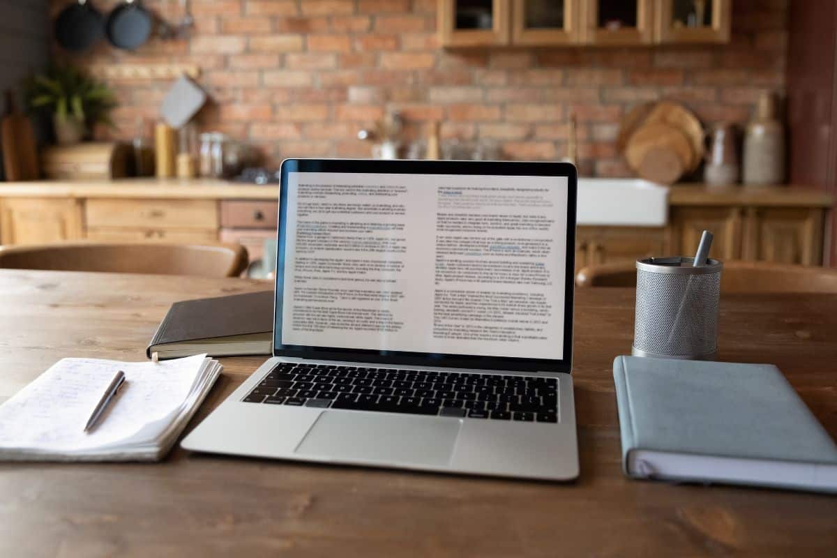 Close up modern laptop with electronic document on screen standing