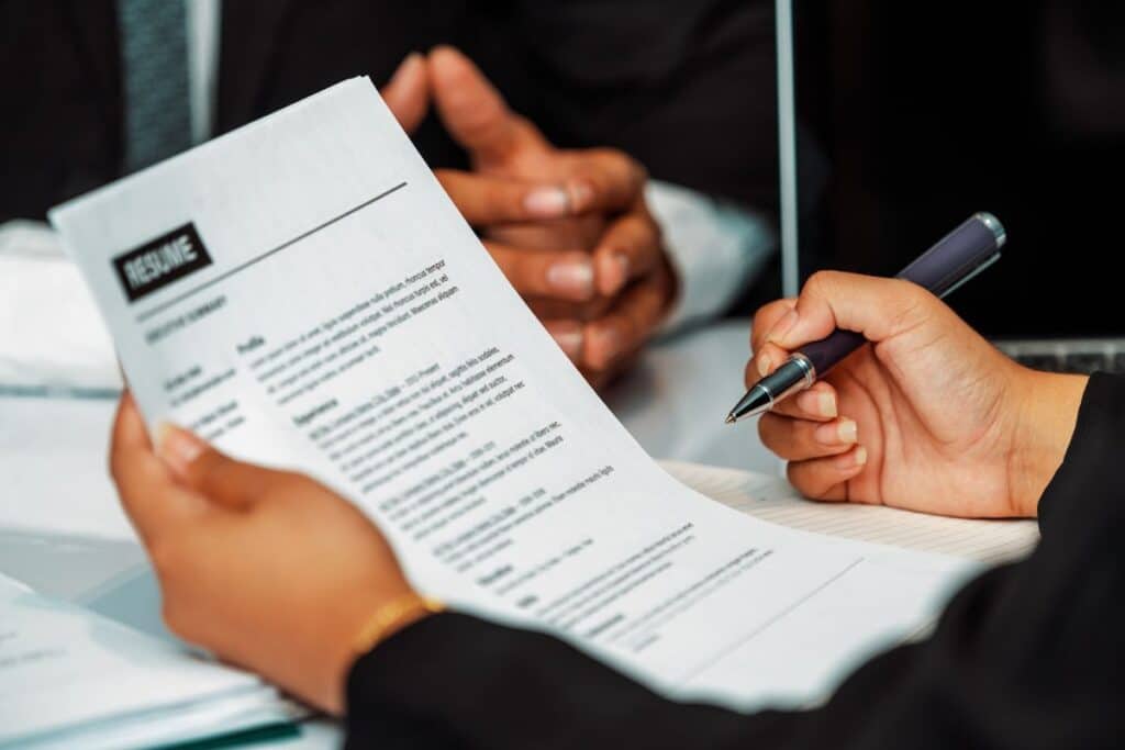Human resources department manager reads cv resume uds