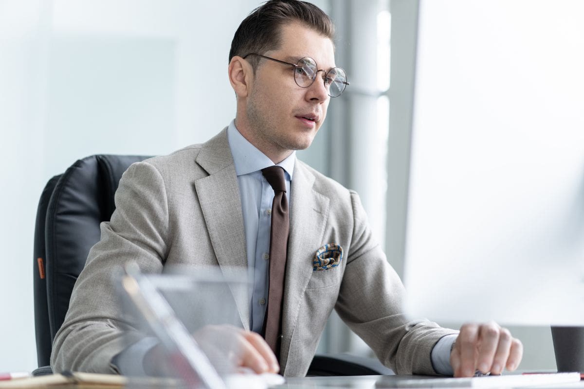 Young employee looking at computer monitor during working day
