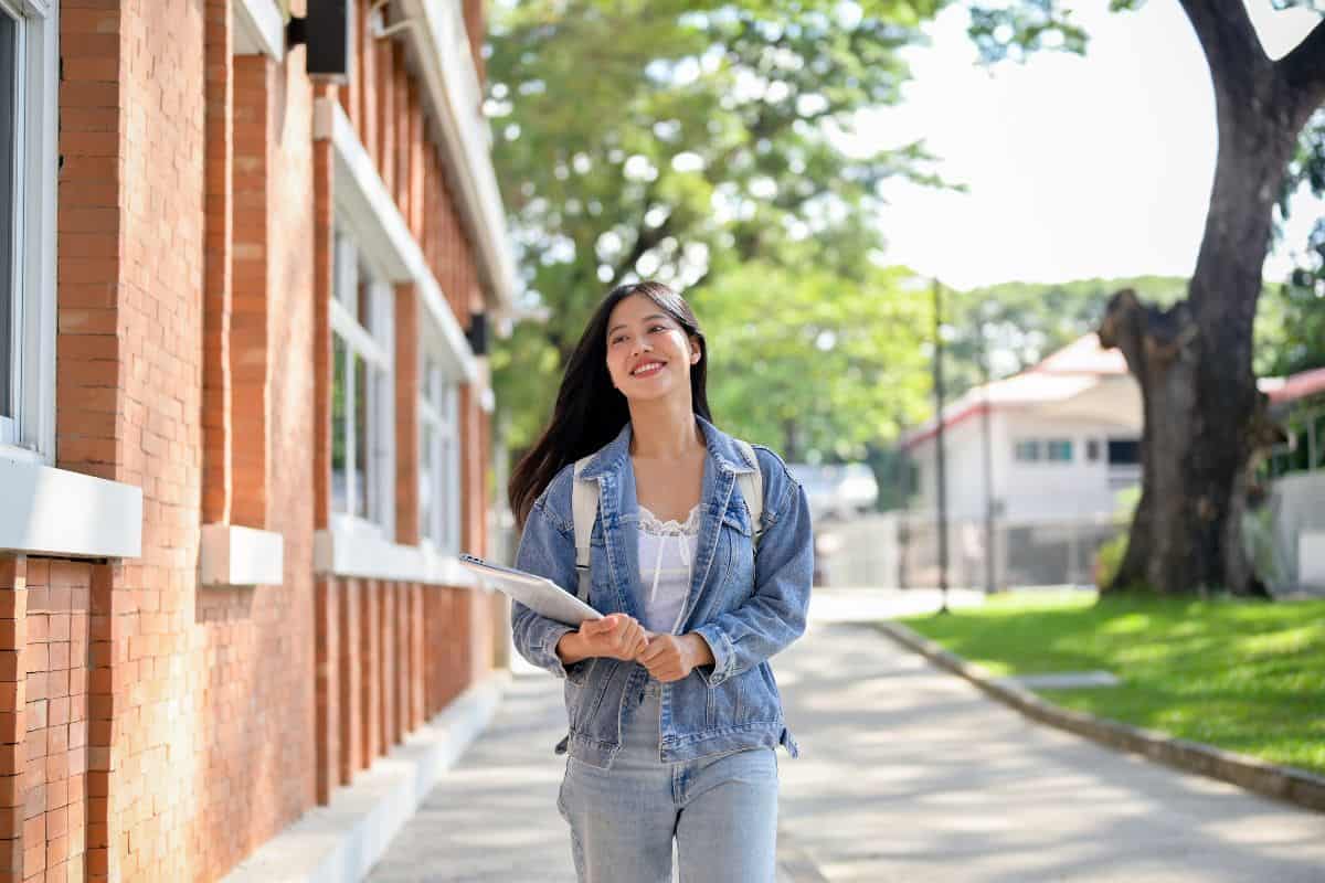 A beautiful smiling asian female college student