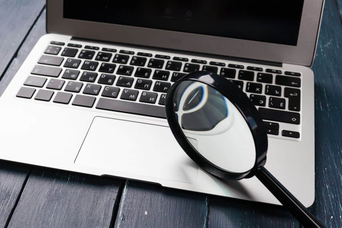 Laptop keyboard on the wooden desk
