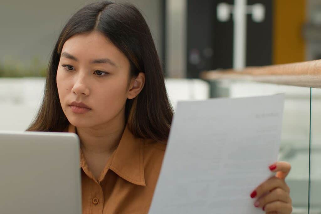 Asian businesswoman working with papers 