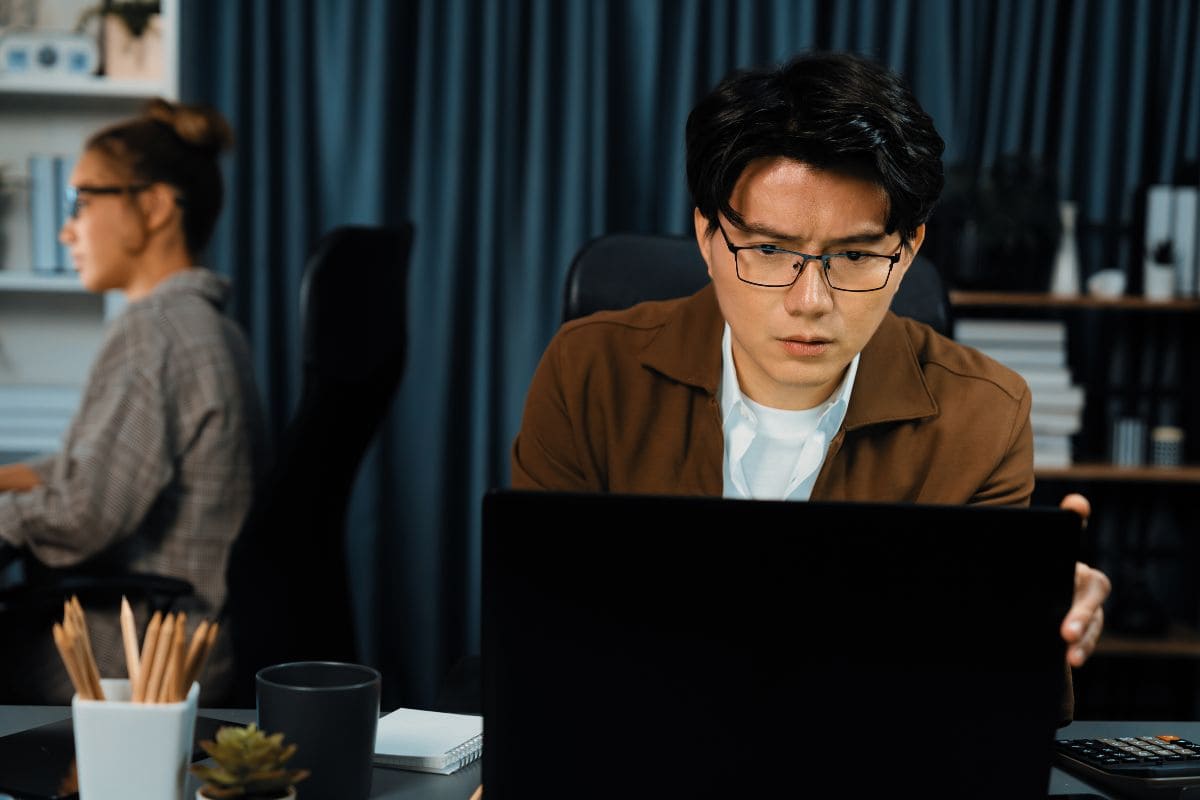 Businessman working laptop waiting email