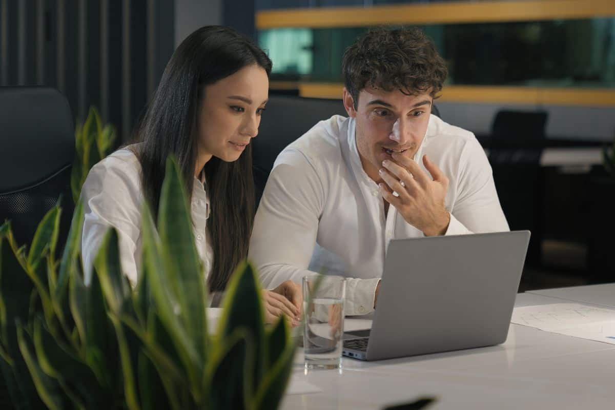 Happy excited winners successful business colleagues