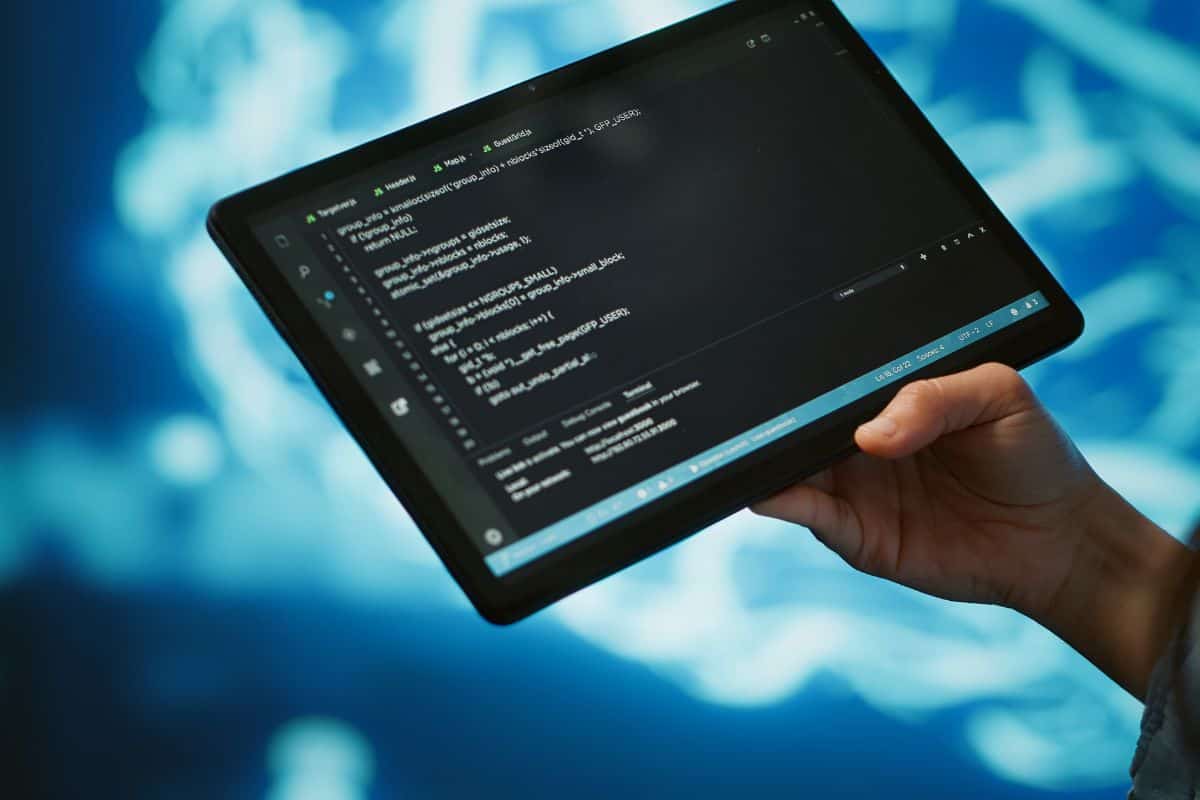 Close up of it professional using tablet building ai algorithms