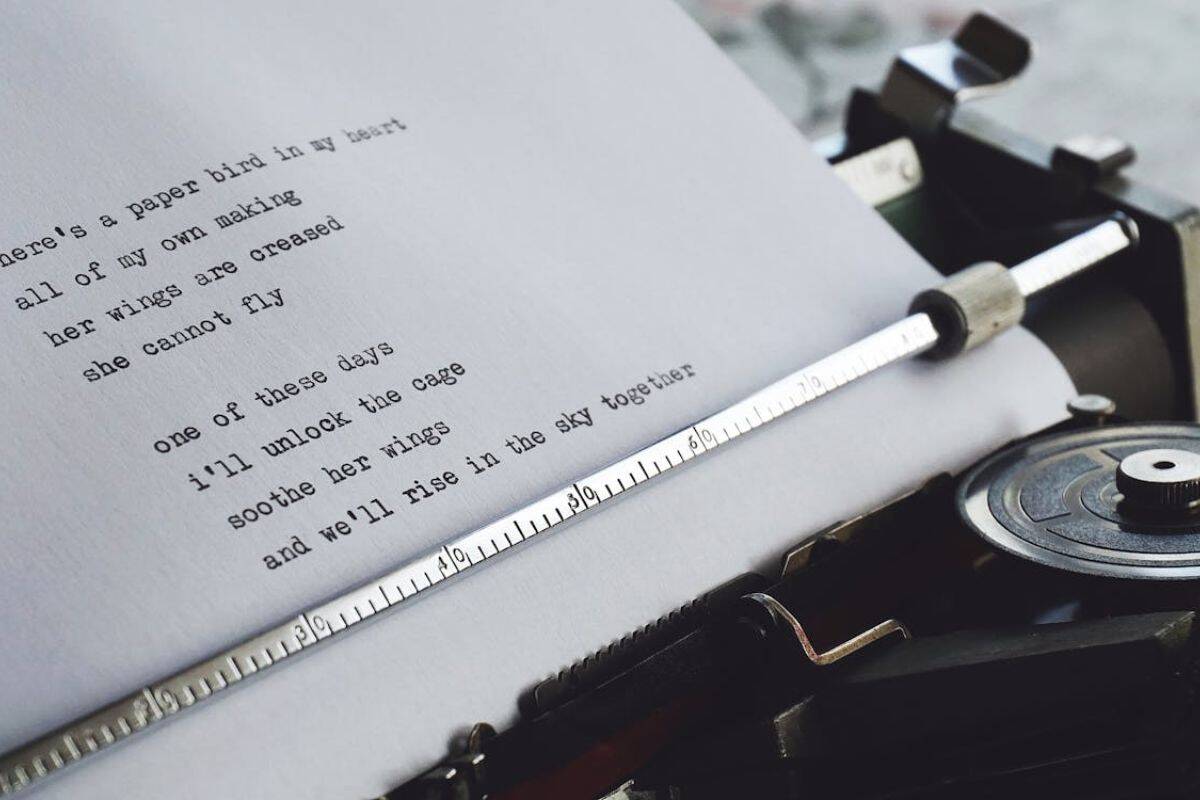 Stock image close-up of a typewriter with a sheet of poetry inserted