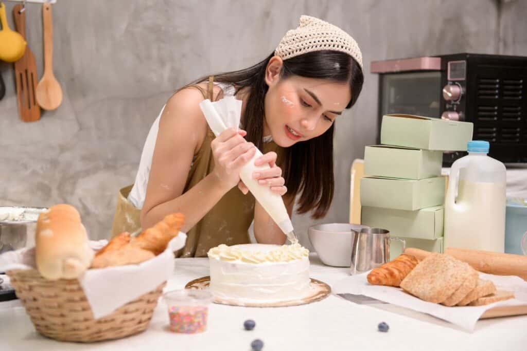 Young beautiful woman is baking