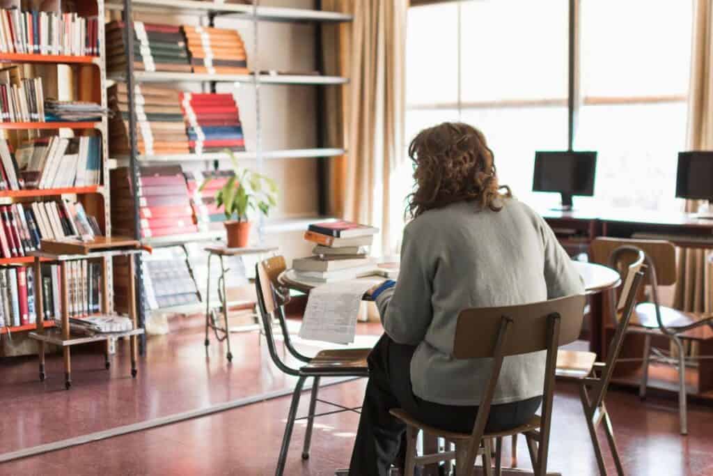 Anonymous woman working in library