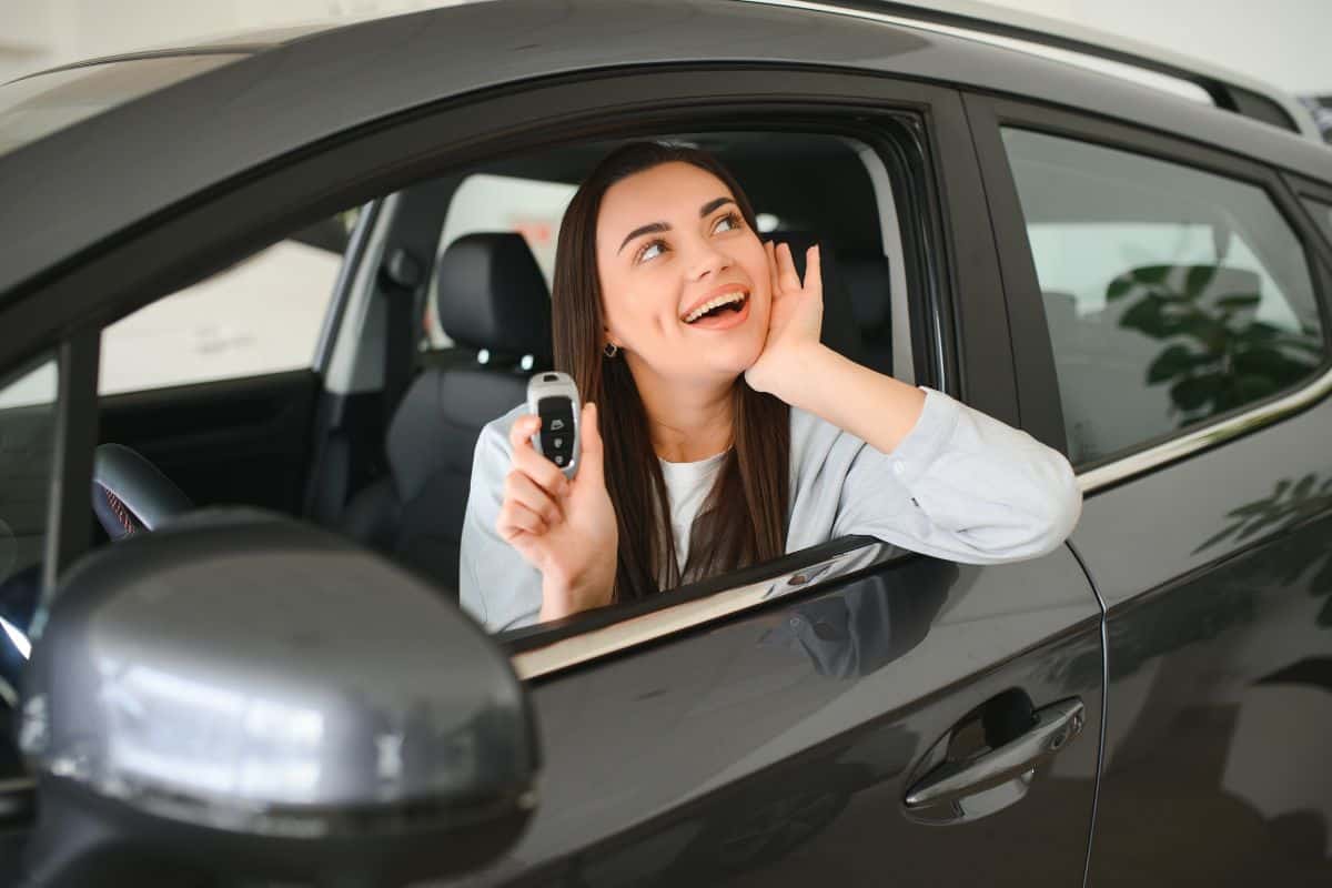 Woman customer female buyer client chooses auto sales concept