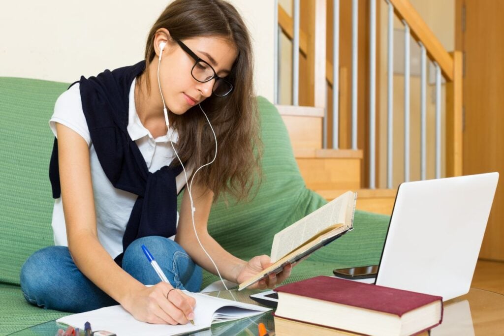 Young girl using laptop at home
