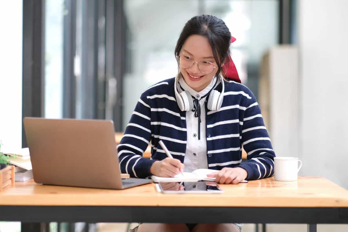 Student learning on laptop indoors