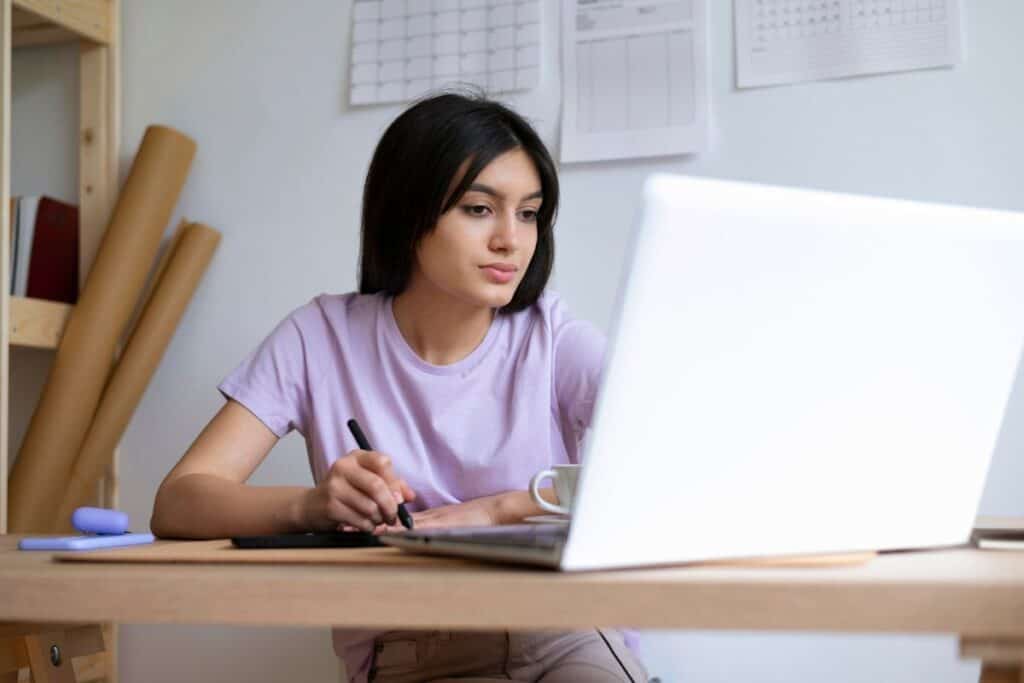 Medium shot woman working at desk