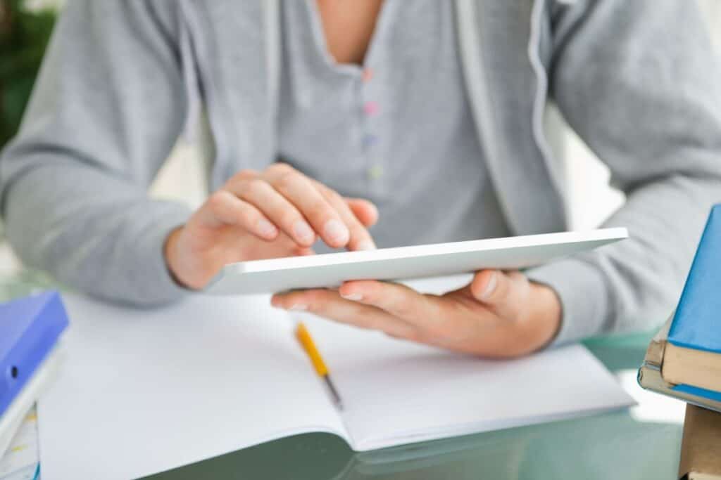 Close-up of a student using a touch pad