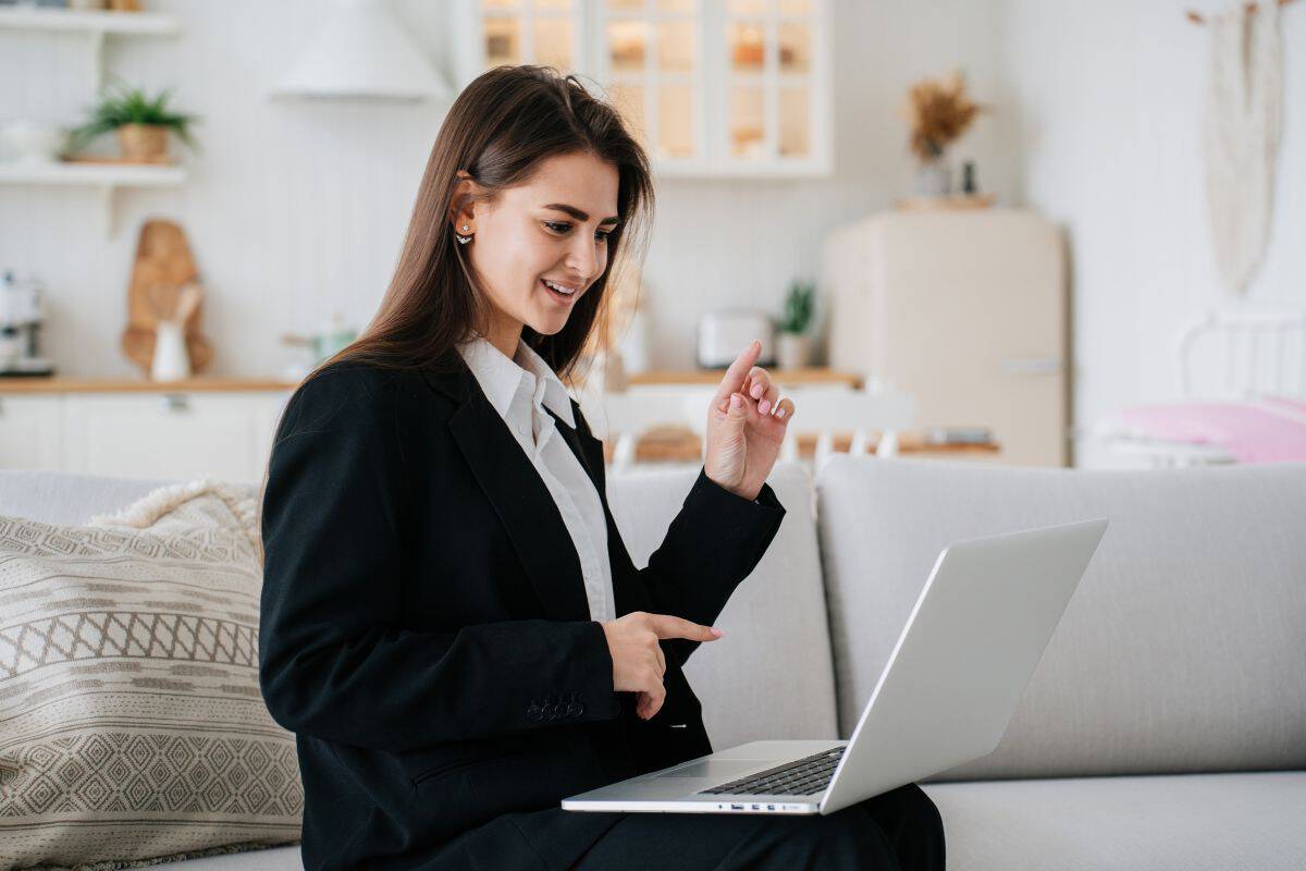 Young cheerful woman in black suit and white shirt