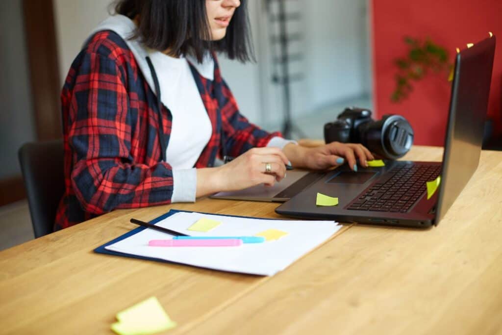 Creative female photographer using graphic drawing tablet