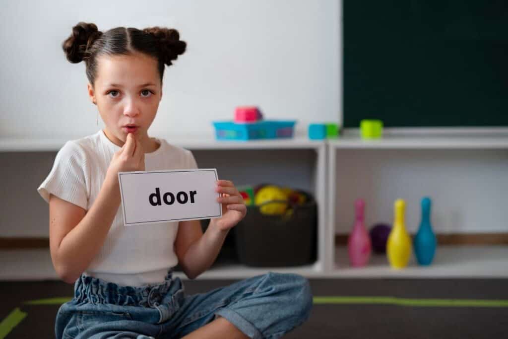 Little girl doing speech therapy at a clinic