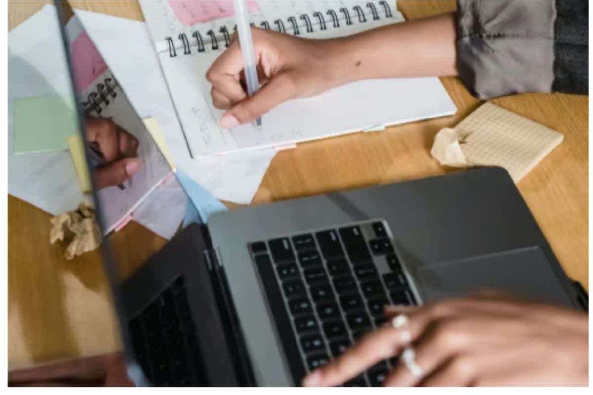 Midsection of man working on table