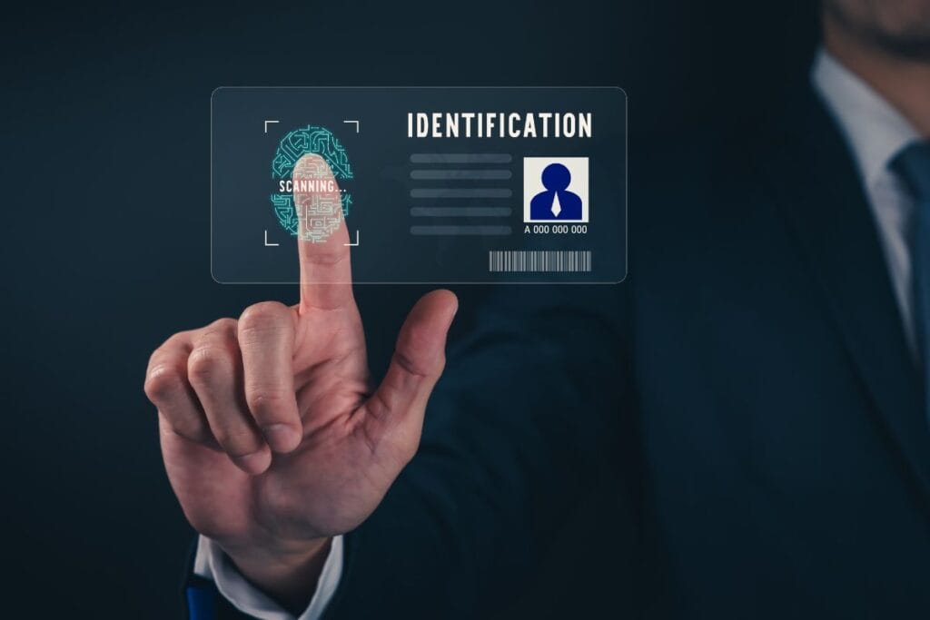 Businessman wearing black suit and hand touch interface scanning