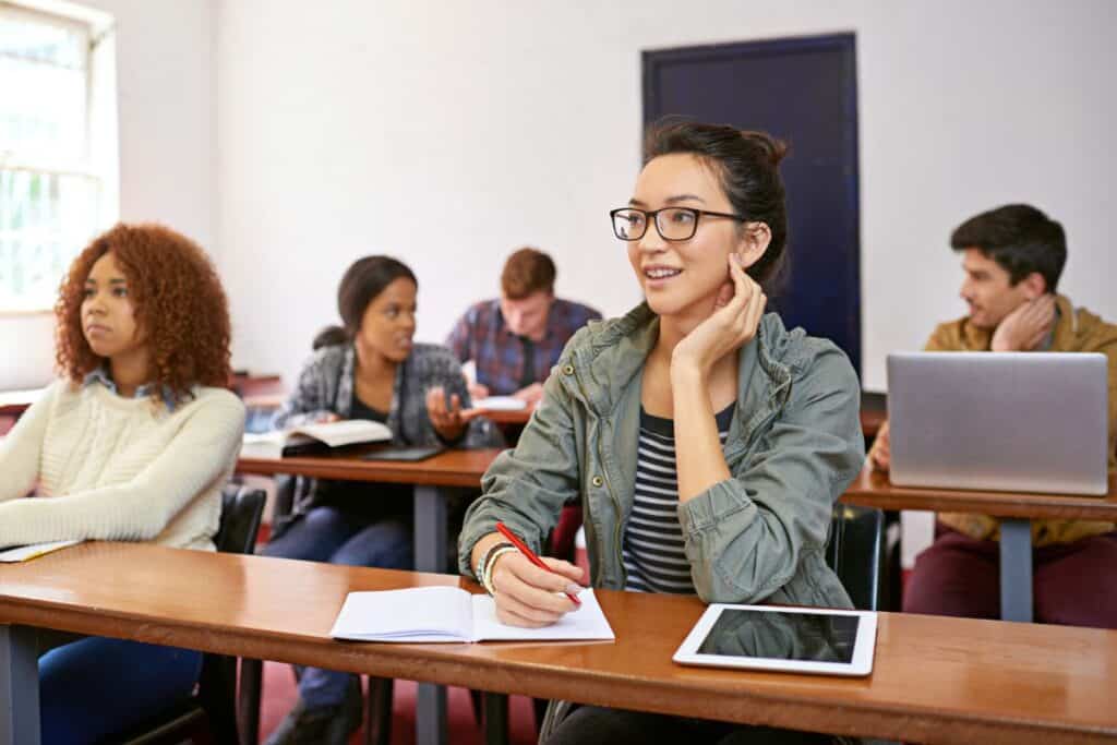 Classroom student and thinking with smile in university