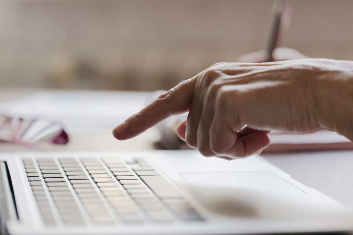 Crop hand using laptop