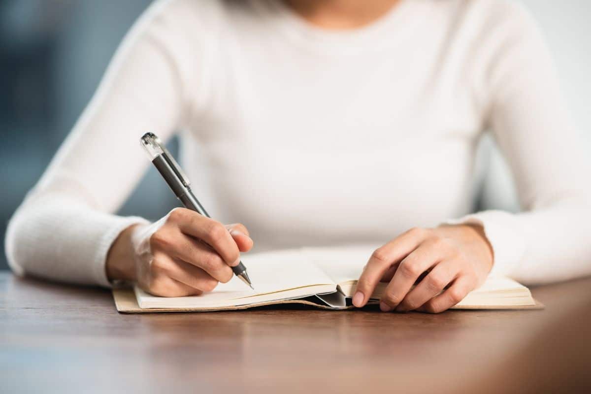 Close-up female student sit for exam at university classroom