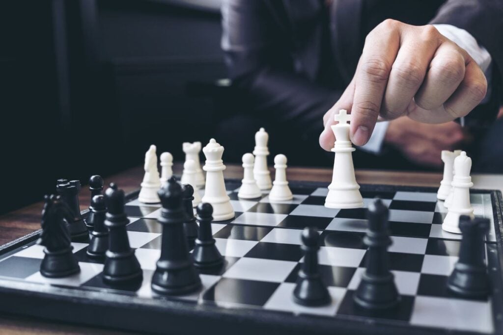 Close-up of man playing chess