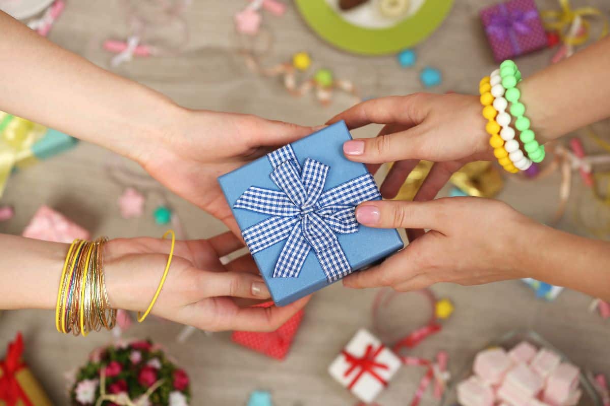 Female hands holding gift close-up