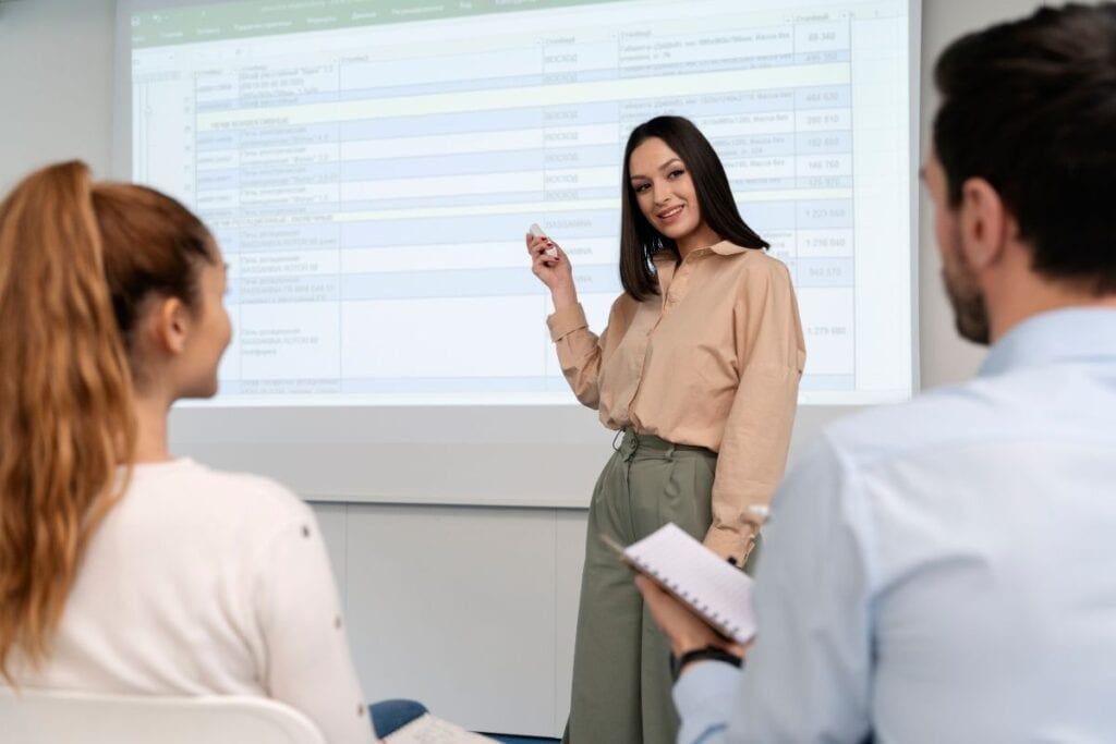 Business woman holding a presentation in the office for her colleagues
