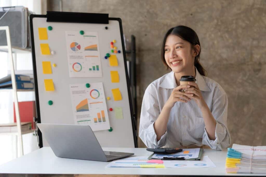 Young woman working on a laptop in the office 