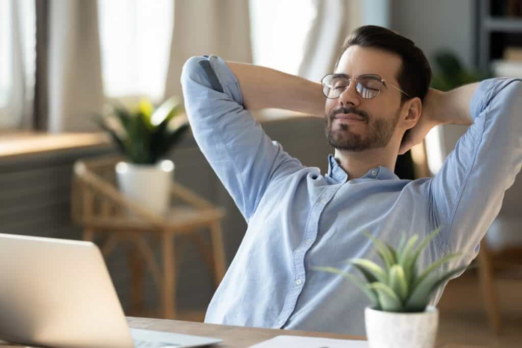 Calm millennial man in glasses