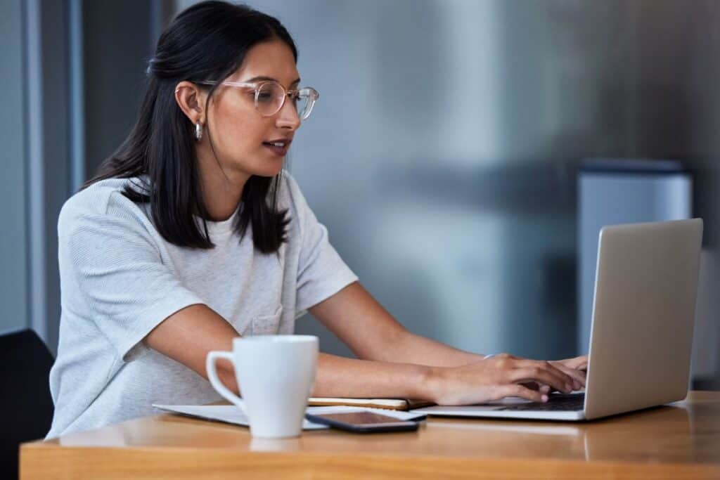 Office business woman and laptop for typing research and copywriting