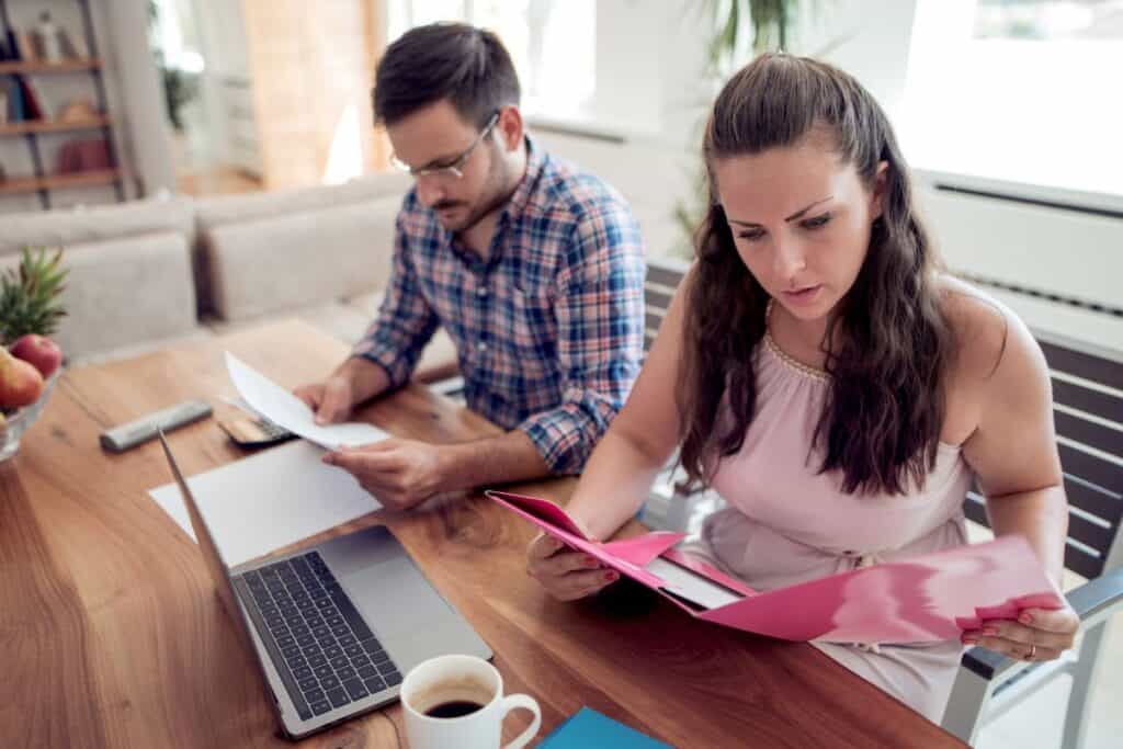 What is Global Plagiarism? 4 Young couple looking at family finance papers