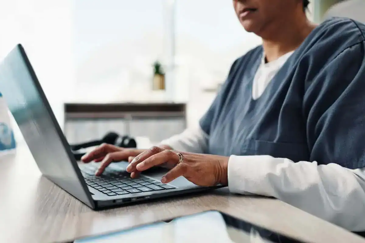 Hands nurse and typing on laptop for healthcare research