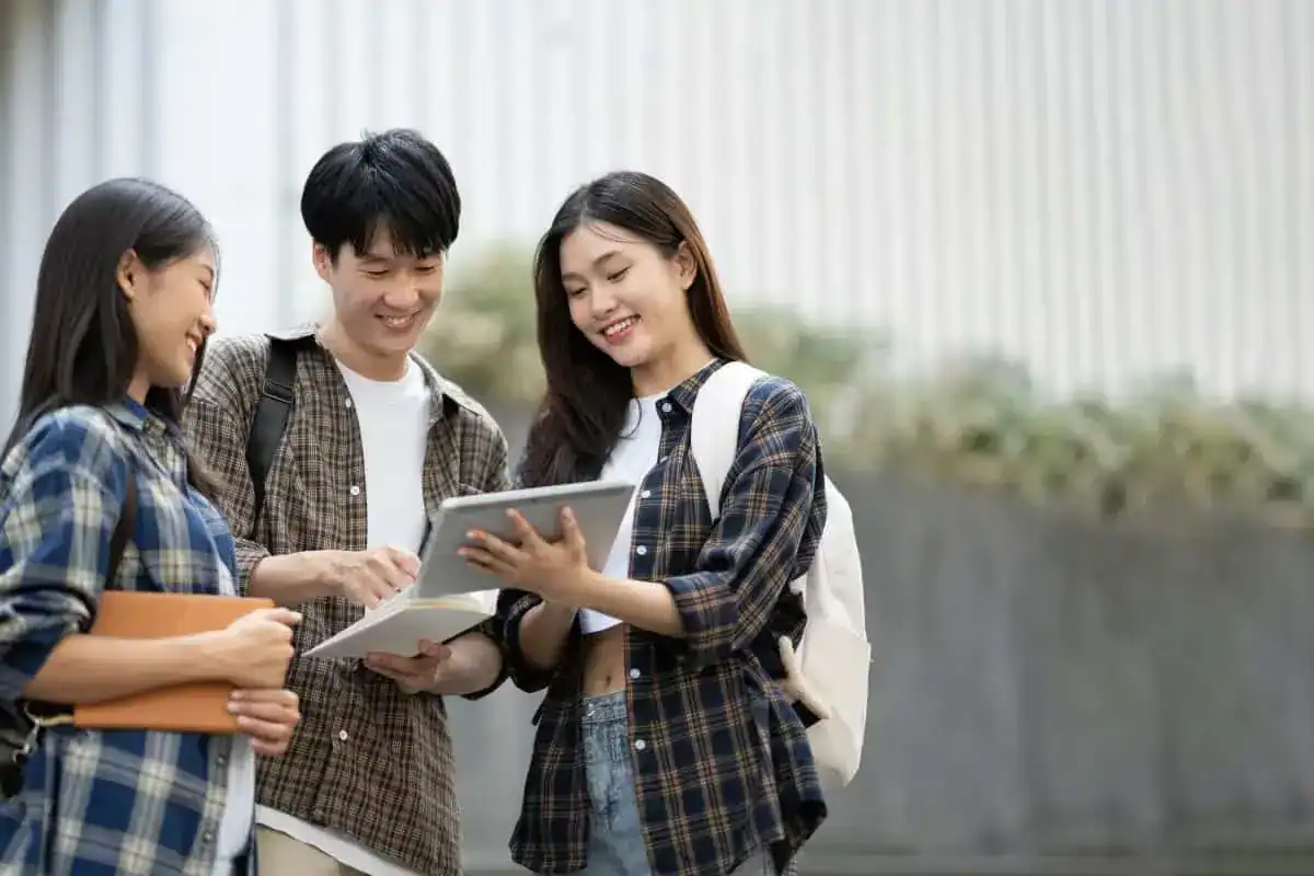 Group of young asian college students are studying together in university