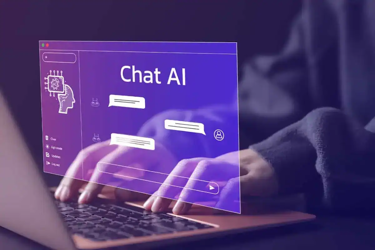 Person typing on a laptop with the help of Chat AI