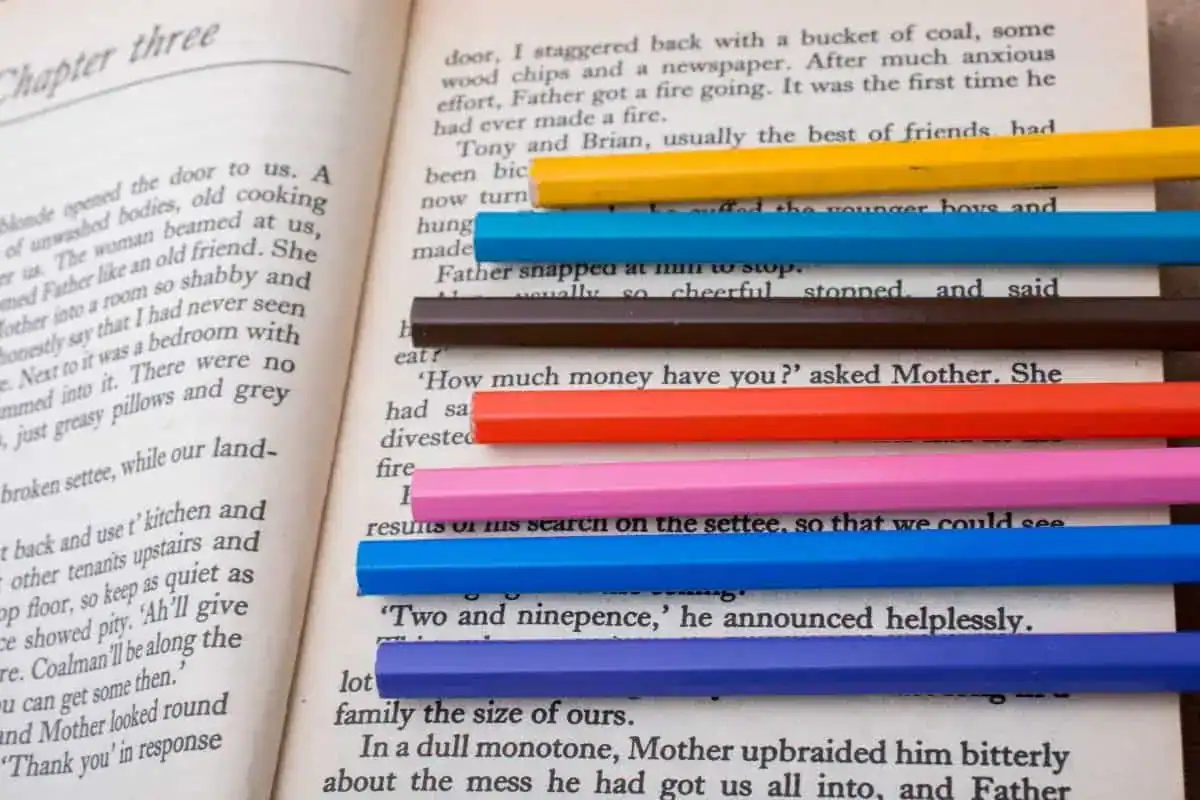 Color pencils placed on the page of a book