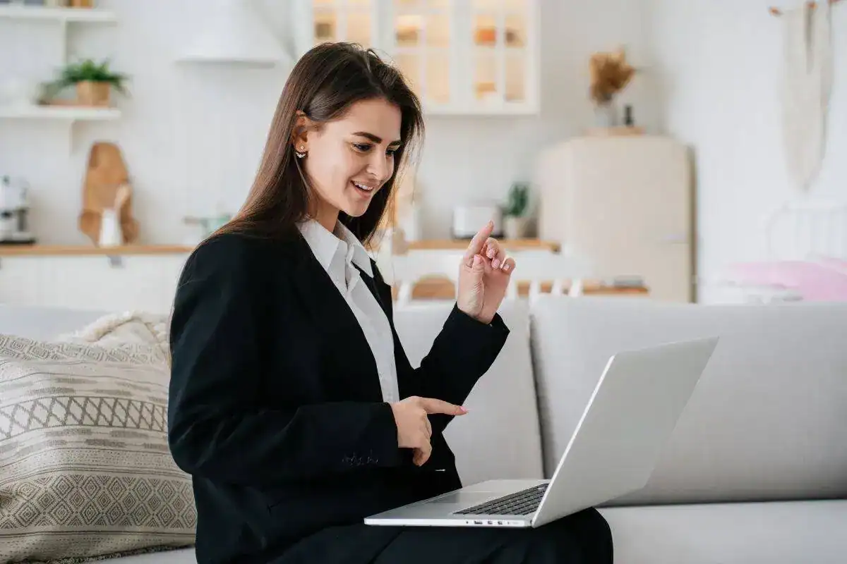Young cheerful woman in black suit and white shirt