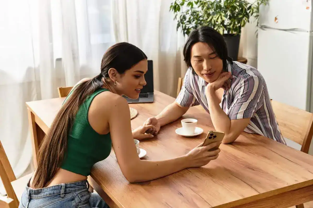 Loving couple shares moments over coffee while relaxing in their cozy home