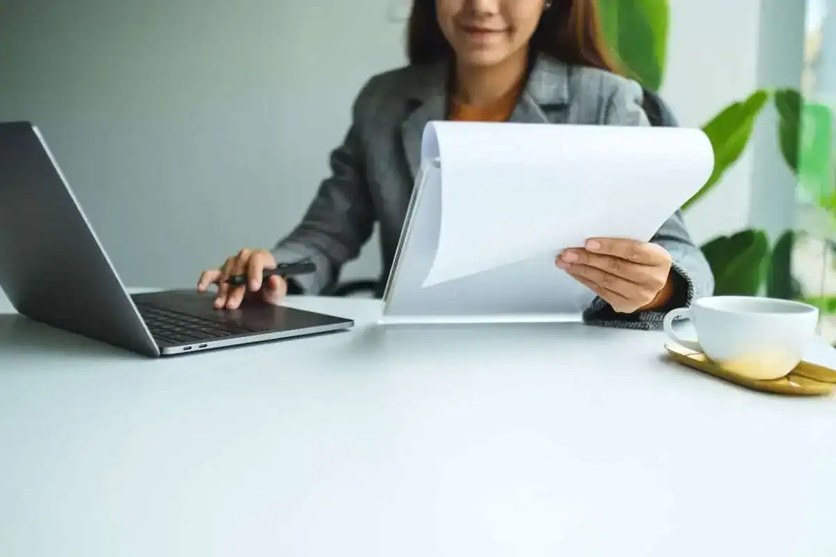 Closeup image of a businesswoman using laptop computer while working