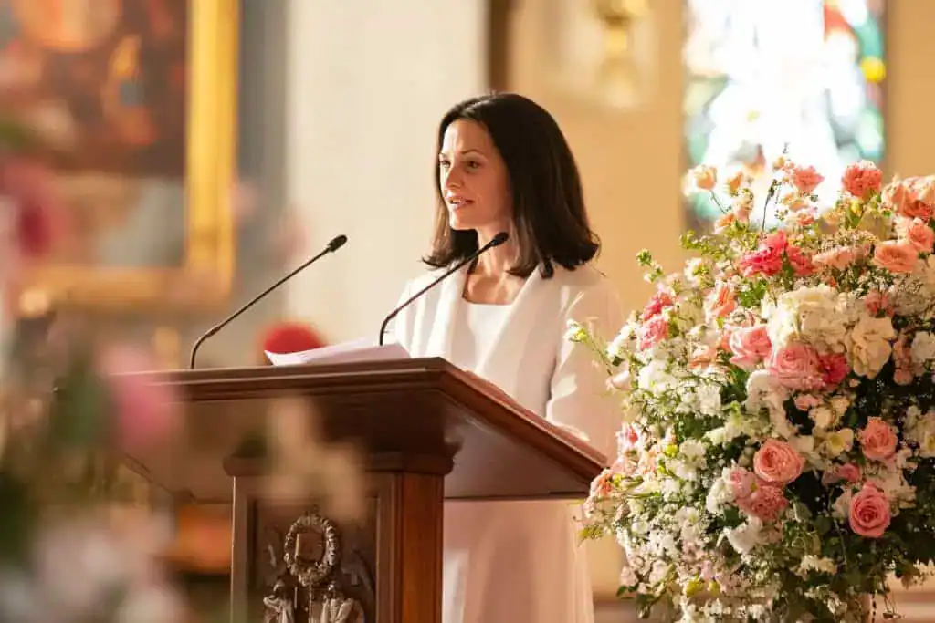Elegant woman delivering speech at church ceremony