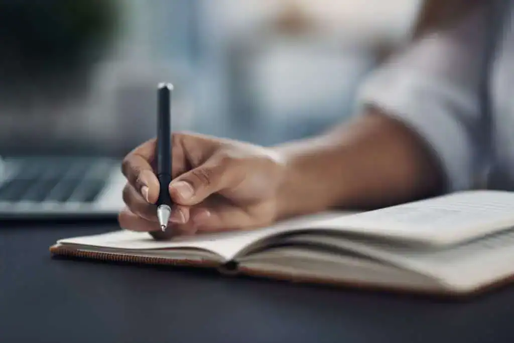Person hand and book in office
