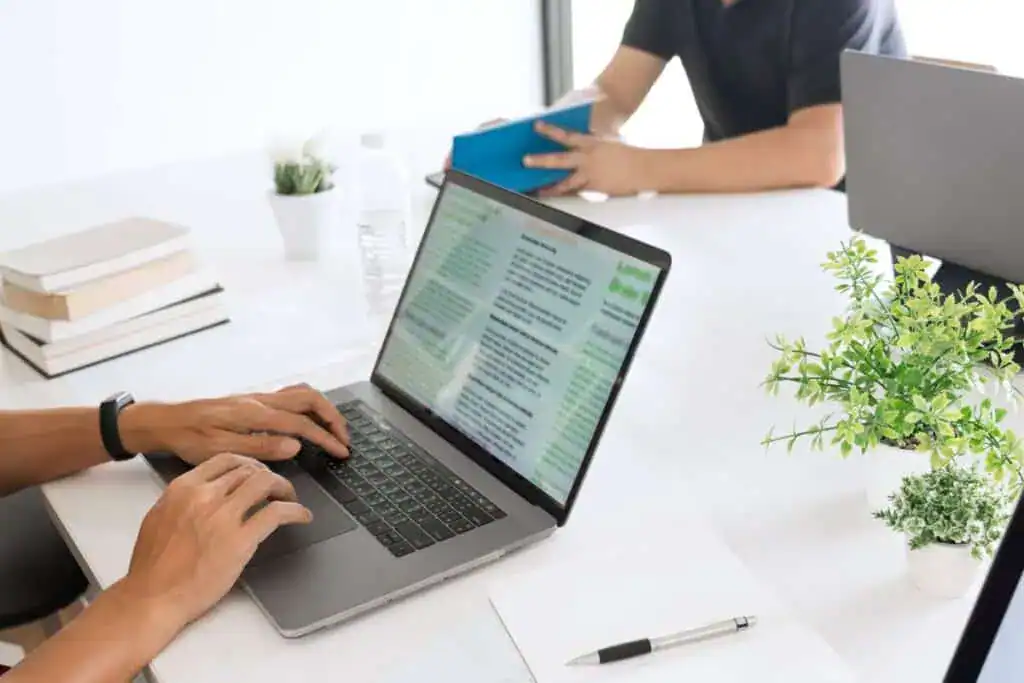 Low angle view of man using laptop on table