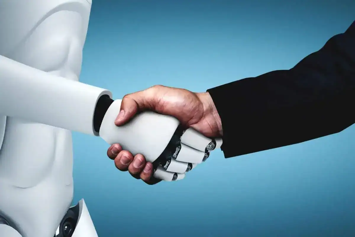 Humanoid robot shaking hands with a man