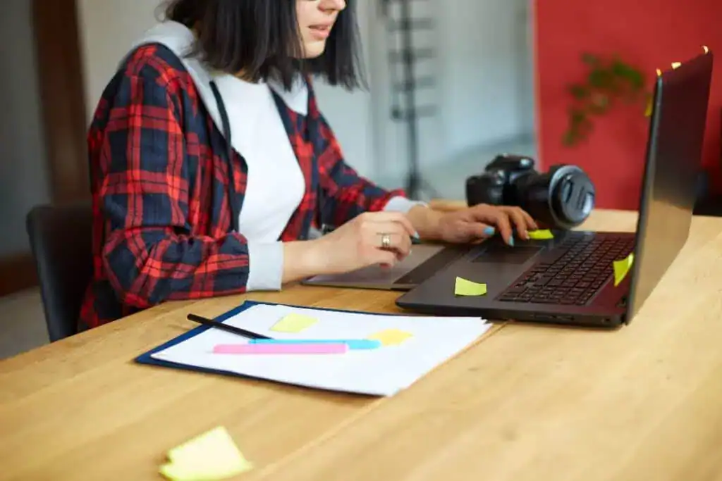Creative female photographer using graphic drawing tablet