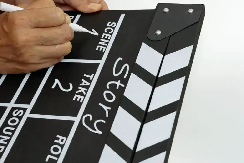 Focus the hand is holding clapperboard 