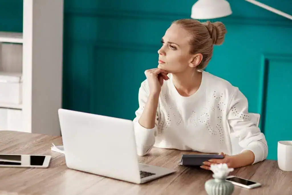 Serious woman planning her budget