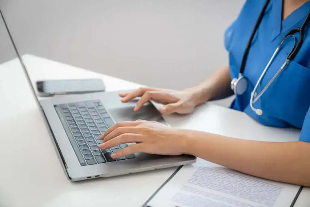 Professional doctor using laptop consultation online