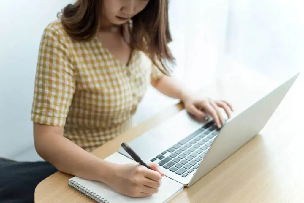 Entrepreneur concept a young female entrepreneur doing notetaking