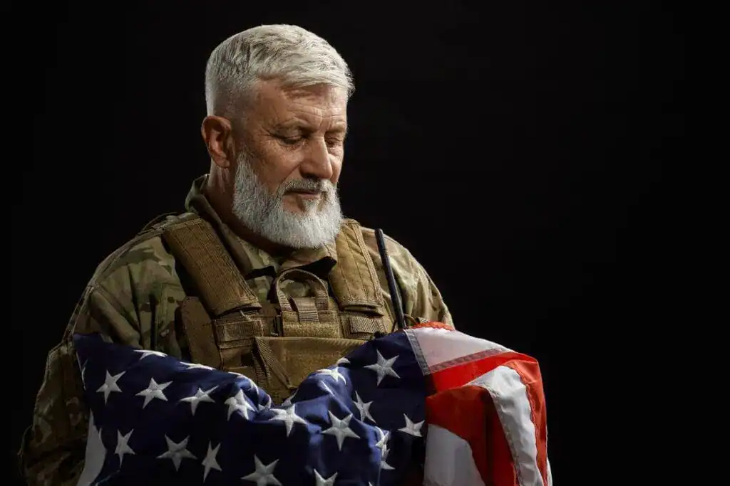 military-veteran-holding-american-flag