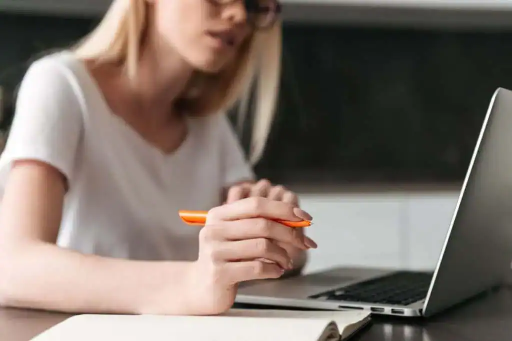 photo of young businesswoman working with laptop at home